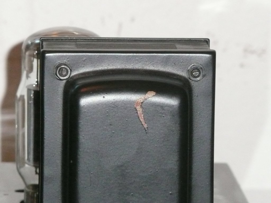 Scratch on rear back of left output transformer