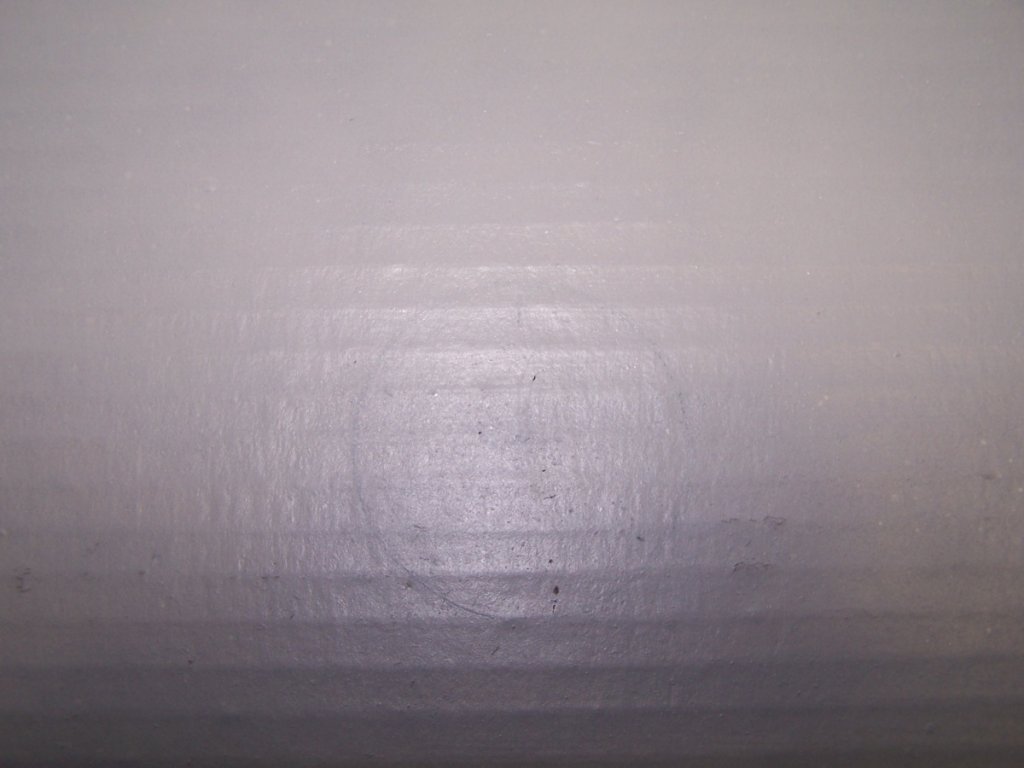 Very light coat of spray paint allowed me to see where I had laid out my Monacor #1 position point. I scraped the paint off of the contact area prior to gluing.