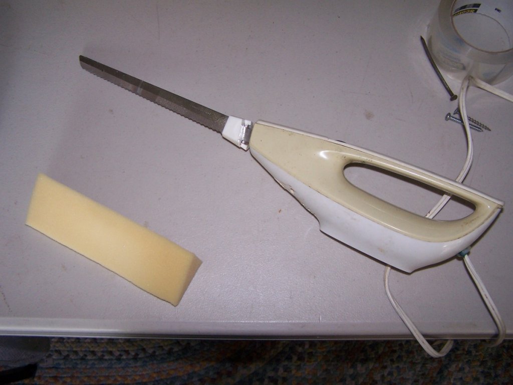 Electric carving knife. The only good way to cut upholstery foam. Medium density foam is what I used.
