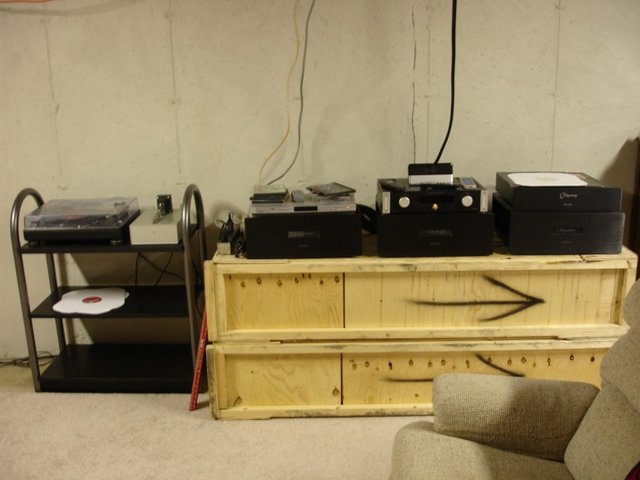 Basment Theater Electronics - 3 x Odyssey Stratos Monos and 1 x stereo Odyssey Stratos in Khartago case
Emotiva LMC pre, SB3, Daewoo DVD(Region Free!), Technics 1200 and Hagerman Cornet2 pre
Stand: RAW RA-8 crates