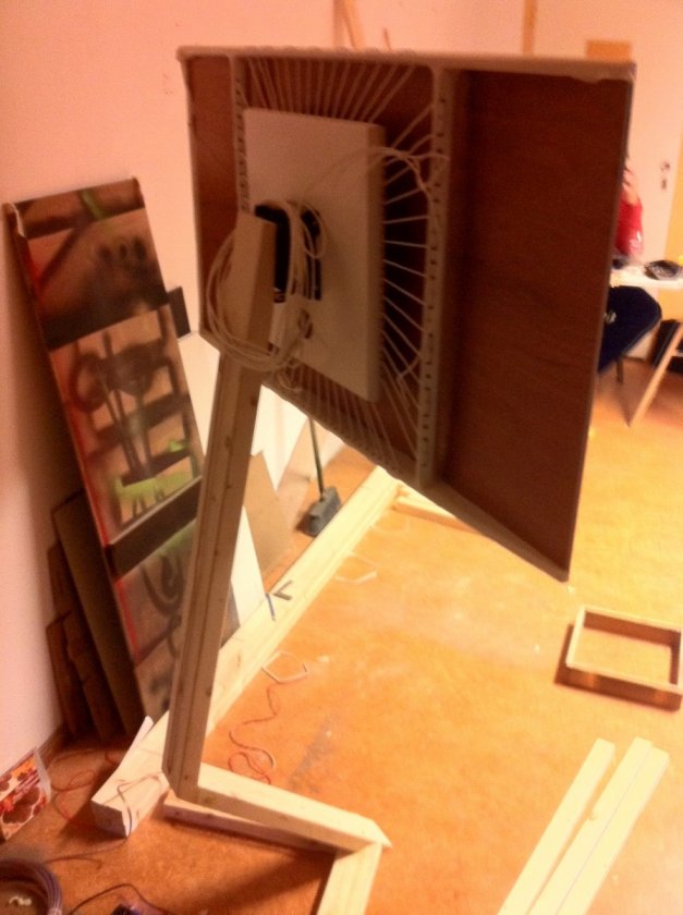 rear view of speaker showing suspension of panel with rubberized cord