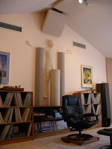 This is the back wall to my listening room showing some of the room treatments. The sclupture is from a friend of mine. The illusion is of a man extruding from the wall. For you science fiction fans, the idea came from when Hans Solo was frozen in carbonite.