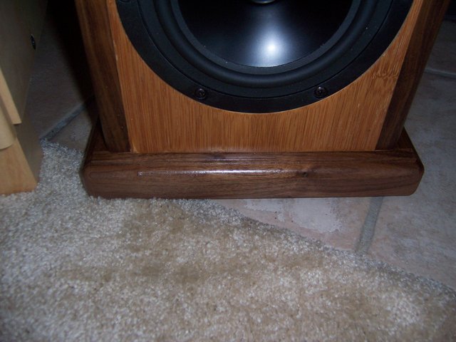 A closer view of the base on which the speakers stand. Edges are real walnut.