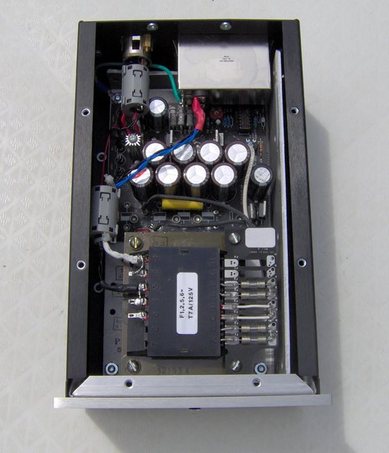 (crooner PS) PS Outdoor Nudie (top) - Here you can see the top quality parts used inside. The IEC connector/Switch/Fuse holder assembly has a built-in RFI/EMI Filter.

The capacitor reservoir uses several small low ESR units and has a top quality film capacitor bypass. Total capacitance is 55,000 microfarads.

Ixys HEXFREDs, Kimber Kable and Silver Teflon cabling are used throughout.

Top quality TDK Ferrite Cores are used to suppress stray RFI/EMI emissions.
