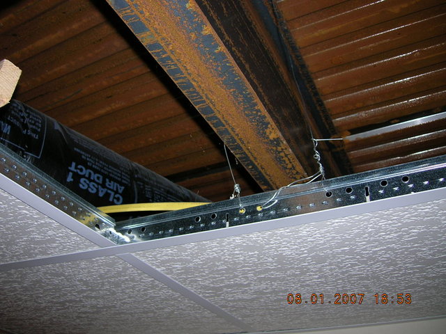 ceiling shot - picture under the garage, have about 3-4 inches between ceiling frame and steel beam.
