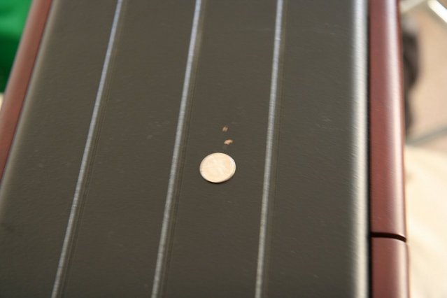 Bottom of speaker - A copule small finish peel off at the bottom of the speaker.