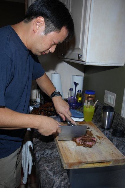 Phil cutting the grilled steak