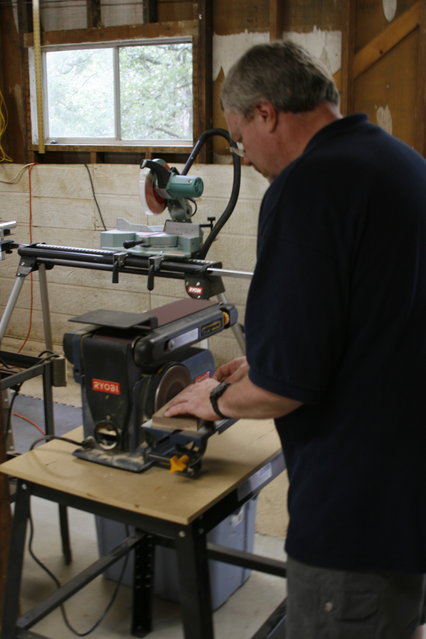 Mark sanding the walnut armboard
