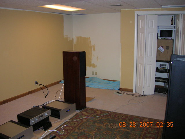 front right corner & audio closet - The half painted area in corner above the blue drop cloth will become enclosed with another closet.