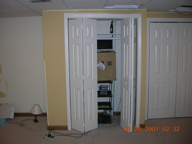 audio closet on right wall - second set of white doors to the right covers the electrical panels.