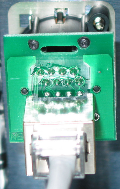 Neutrik XLR Ethernet Passthru - Backside of Neutrik Ethernet passthru that mounts in standard XLR mounting hole.