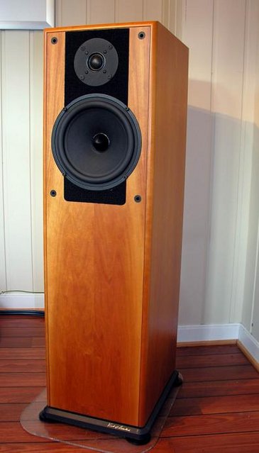 Doxa 8.1 Signature/Silver S/Revelator... - A norwegian classic.
No longer in production.
So.. how does it sound?
Like Sonus Faber Extrema mated to Quad ESL.
Goes really deep in the bass with great dynamics.
I don't know how deep. But I've never heard anyone use subs with it.
It had a cabinet of real wood. 
The price was low compared to what it can do!
A bit difficult to place. This is a Ferrari...with testicular fortitude..
Mia E' Veloce ...