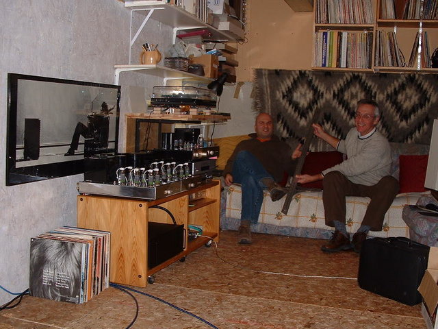 TEO 001.JPG - Ken (left) and Taras demonstrating some hard and fast rules regarding their Magnetohydrodynamic Liquid Cables. After listening to music for 30 minutes or so, I wouldn't let them leave with those "MHD's"..... So I threatened them with a blank cheque.