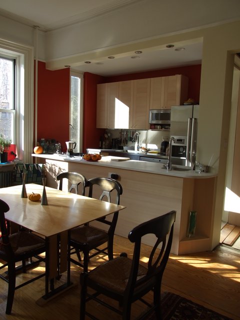 Kitchen/Dining room - Originally main bedroom with separate kid bedroom. Wall partially removed, doors/trim removed. Ceiling dropped in kitchen area. Upper portion of wall reinforced and used for counter lights. Window in kitchen resized to custom size.