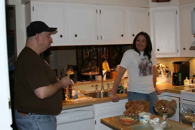 Mark and Laura hovering around the eats