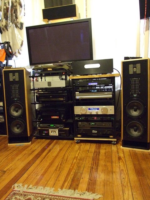 My music originates from this mess. lol - Separate Stereo and HT systems dominate my small NYC apt.