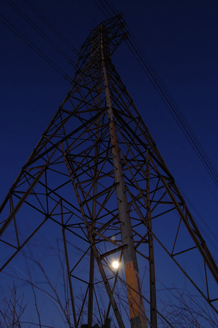 A tall tower stretches into the night