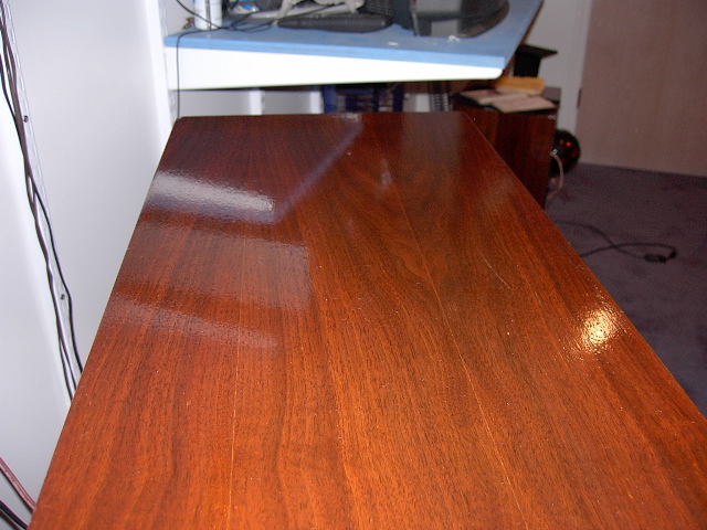 sand with 100, 150 then 220 sand paper, then put 2 coats of Minwax #224 walnut stain, then 5coats of Minwax super-high gloss polyeurthane to get this finsish (the spekaer was pretty dusty in that picture, and didn t reflect as much as I wanted it to, I