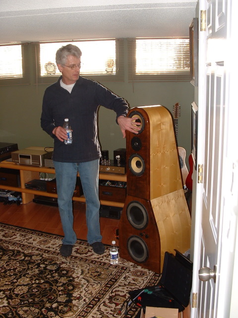 NE 022.JPG - Tony is showing the members how to properly caress, er, clean dusty drivers....