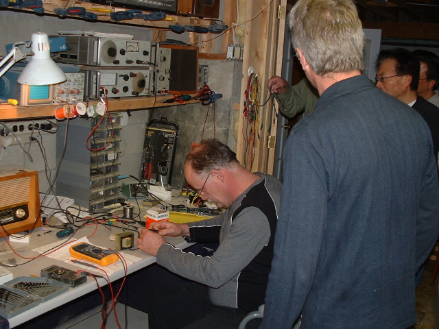 NE 052.JPG - Peter makes himself at home in Tony's well-organized workshop.