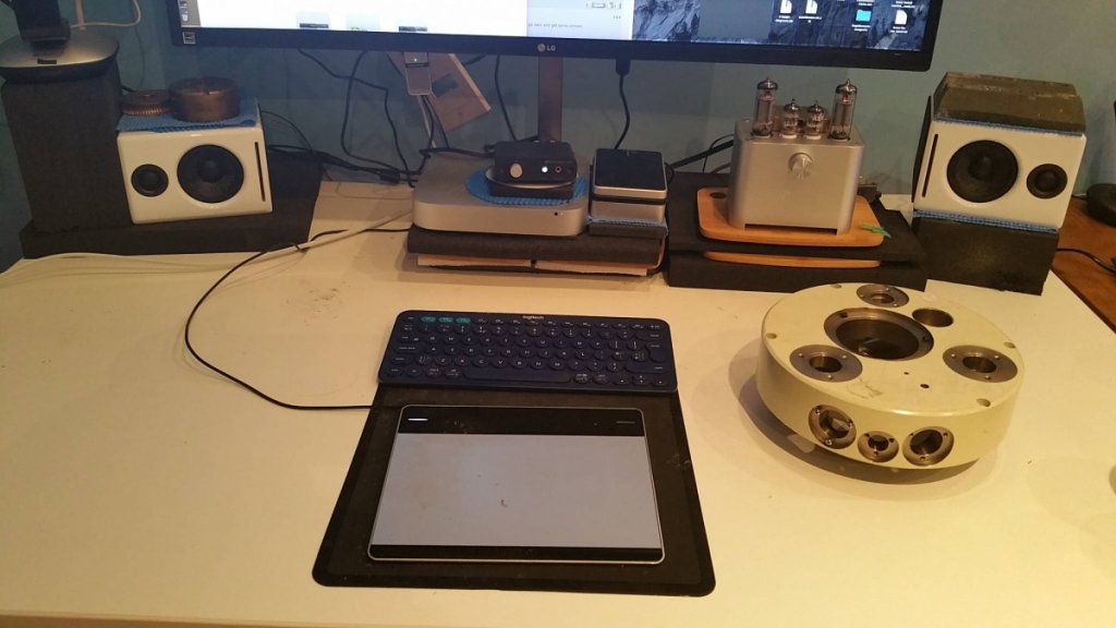 Coupling my speakers to the desk with heavy brass & zinc blocks of metal