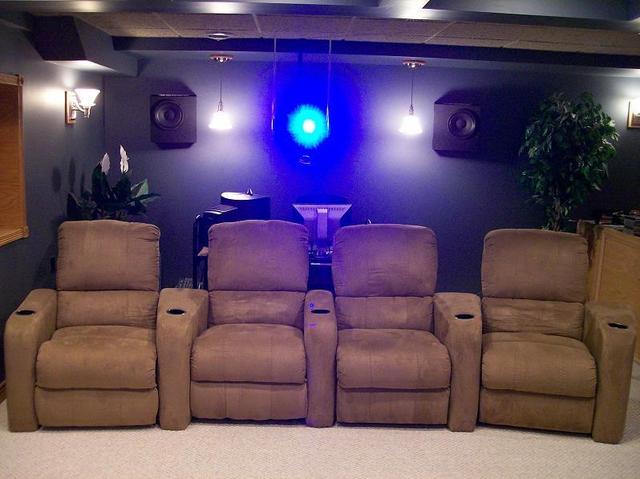 Berkline seating - Projector Glow - Rear surrounds - The 10" Coaxial Hawthorne Audio rear surrounds have since been "rebaffled", but the seating and projector remain unchanged. Note the position of the PC monitor between the center chairs. Makes for interesting auditory experience with multi-channel content sitting there!