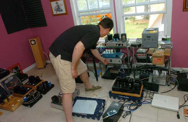 Lots of gear in the Pink Room. Henry adjusts the volume