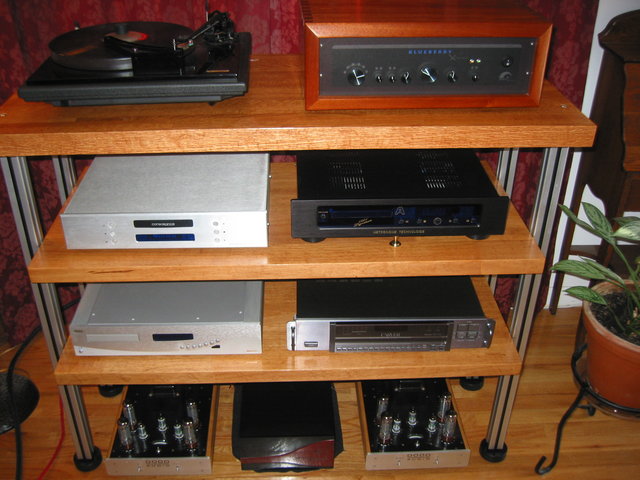 Posts are coupled to floor with leveler feet, but no other attempt to isolate / couple the shelves or any other element of the rack. I use cones under some gear.