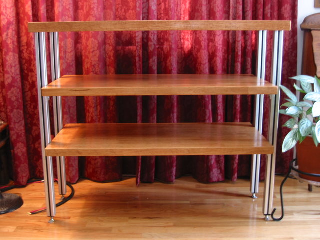 Warm wood, clean lines and elegant, streamlined look. - Stability is fine (ie: not topply). But rack is not as rigid as I had hoped. Nothing serious but there is a slight wobble when lateral pressure is applied. This is due to absence of the horizontal bracing normally seen on these 80-20 style racks......for example, Adona and Steve Blinn designs. I chose to forego the bracing for the greater visual appeal that I think this design provides. But no complaints whatsoever about the sound. It is tremendous, especially digital.