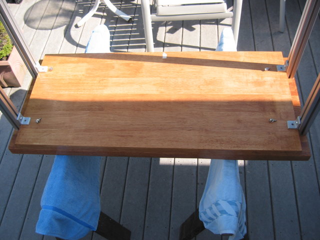 STEP 2: Attaching the bottom shelf. - Lay bottom shelf on underside of top shelf, space and line things up, and then attach hardware. Don't fully tighten.