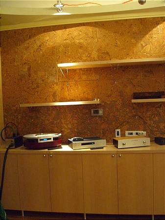 Back wall - Custom made cabinets that holds all the media as well as components. Wall is covered with 0.25 inch cork tiles for acoustic reasons. Also not on the picture - two book cases in the corners that serve as the natural bass traps. Cabinets are made out of MDF, maple ply and 2" thick counter top made out of MDF. Boxes - ply , facing MDF. Cost $1500 for materials - labor and finish = two weeks worth of work with my cousin - the furniture maker.