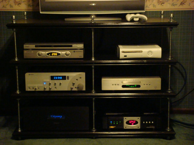 Flexi-Table - This was a 3 week DIY project that my whole family helped out on, for which I am very greatful. Each shelf is made up of three layers of 1/2" MDF board. I followed the directions of the Flexi table made by Humble Homemade Hifi. The middle layer of MDF has two cut out's that are filled with about 6lbs of sand in each cutout making 12lbs of sand per shelf. I used 5/8th's threaded rod for the posts and acorn nuts for the top and the bottom of the posts. The stand is incredibly solid and I now have room.