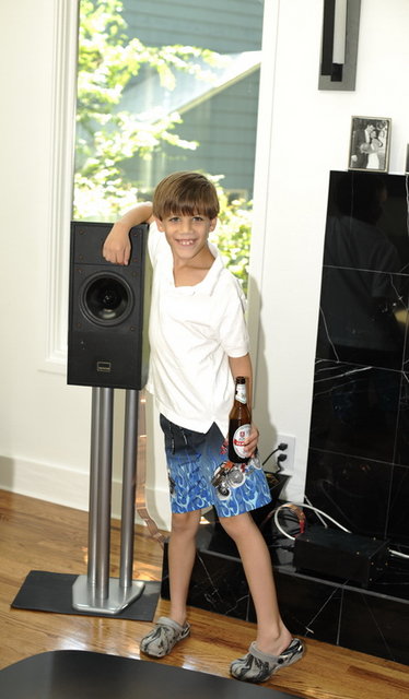 Andrew next to his Epos speakers. Note: beer is not his