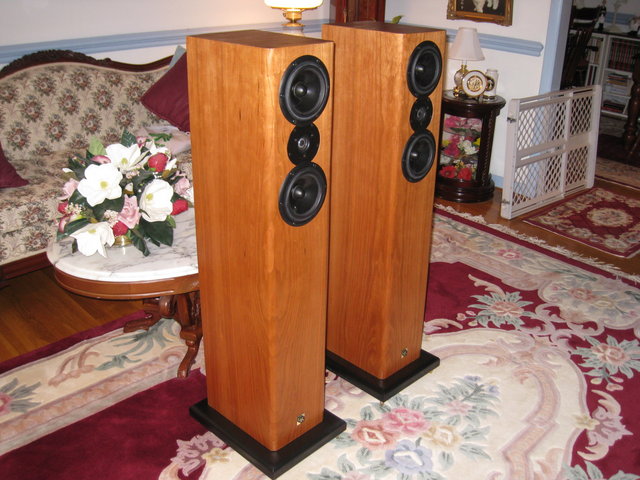 GR Research AV-3 TL Tower Speakers - Front left side view without grills.Natural cherry finish