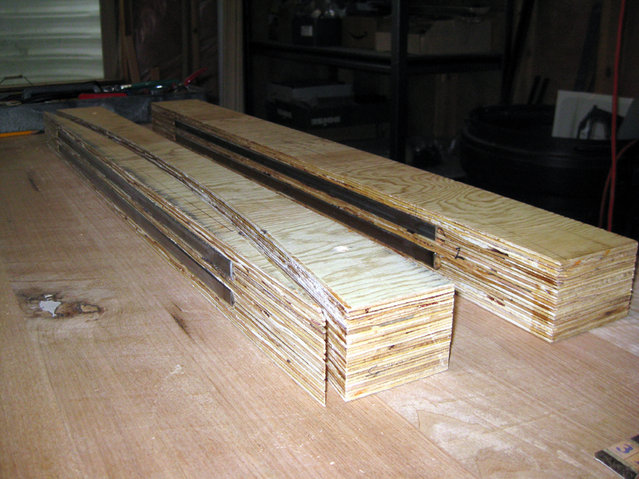 IMG 0226.JPG - Here is one side of the guide rails cut. I've embedded two Â½" rectangular steel tubes into the bottom of the rails to help support the weight of the router.
