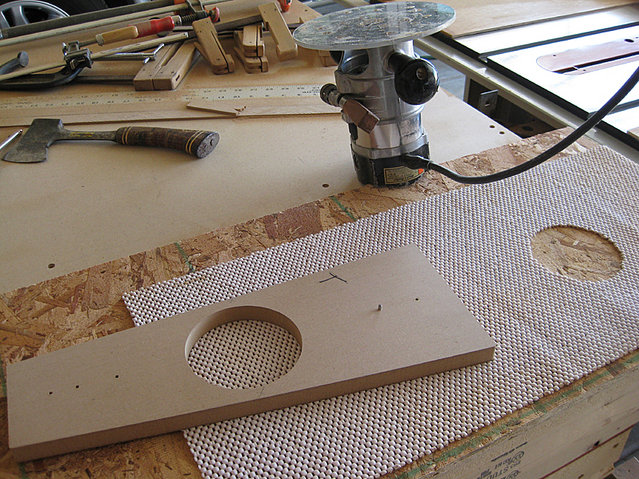 My technique for cutting the circles out of the braces is to use a Jasper Circle Cutting Jig and a piece of non-slip liner. This is the stuff you use to put under a rug to keep it from moving and it's also sold as shelve and drawer liner.
