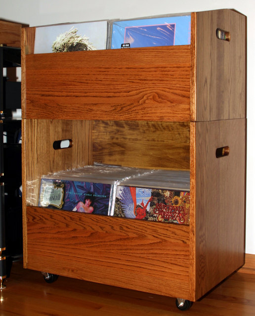 LP Bin - While there are similar bins available, I wanted mine in Oak with a detachable upper section. Front/sides are Oak, while some inexpensive Aspen makes up the bottoms/rear panels. After staining, they were finished with three coats of satin poly. HD casters on the lower section allow for easy movement. Joinery is via Dado/glue with pocket hole screws, using my trusty Kreg Pocket Hole jig. Four 3/8â€ hardwood dowels in the top/sides of the lower bin keep the upper in position. The pocket holes are at the bottom and rear, hidden from front/side view. The bin currently holds a little over 300 of my single and double LPâ€™s. I could jam more in but sorting through them would be difficult. Iâ€™ll add a battery operated touch light to the bottom of the upper bin for lower section illumination. Dimensions are 41â€ x 27.5â€ x 18â€. The bins interior measures 26â€ x 16â€.