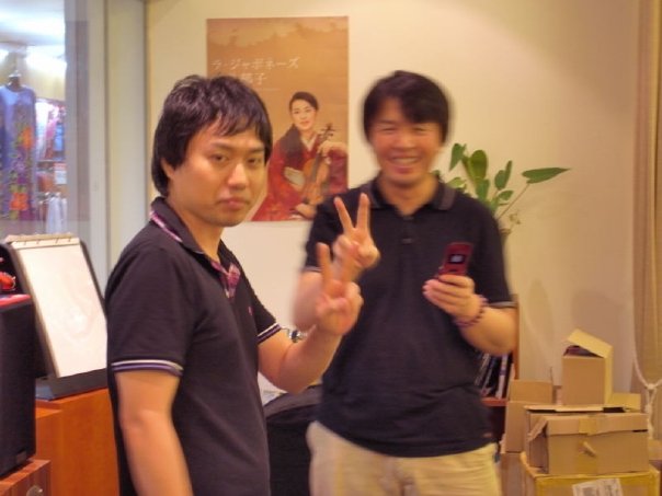 Both Ken-san and Mitsuru-san display victory signs after the successful demo