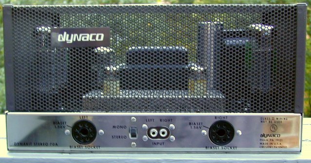 Dynaco Stereo 70 - Factoy-Wired Version - Front View - With Tube Cage/Cover - This is how Dynaco made 'em in 1970. This is a totally un-molested, original, factory-wired Stereo 70. EVERY component is original and working perfectly. The rectifier is a NOS Mullard-manufactured, GE-branded GZ 34/5AR 4. The 7199's are NOS RCA black plates that came from a trusted tube supplier in South America. (Notice the import duty tax stamps!) The EL 34's are a factory-matched quad of Electro-Harmonix EL34EH tubes.