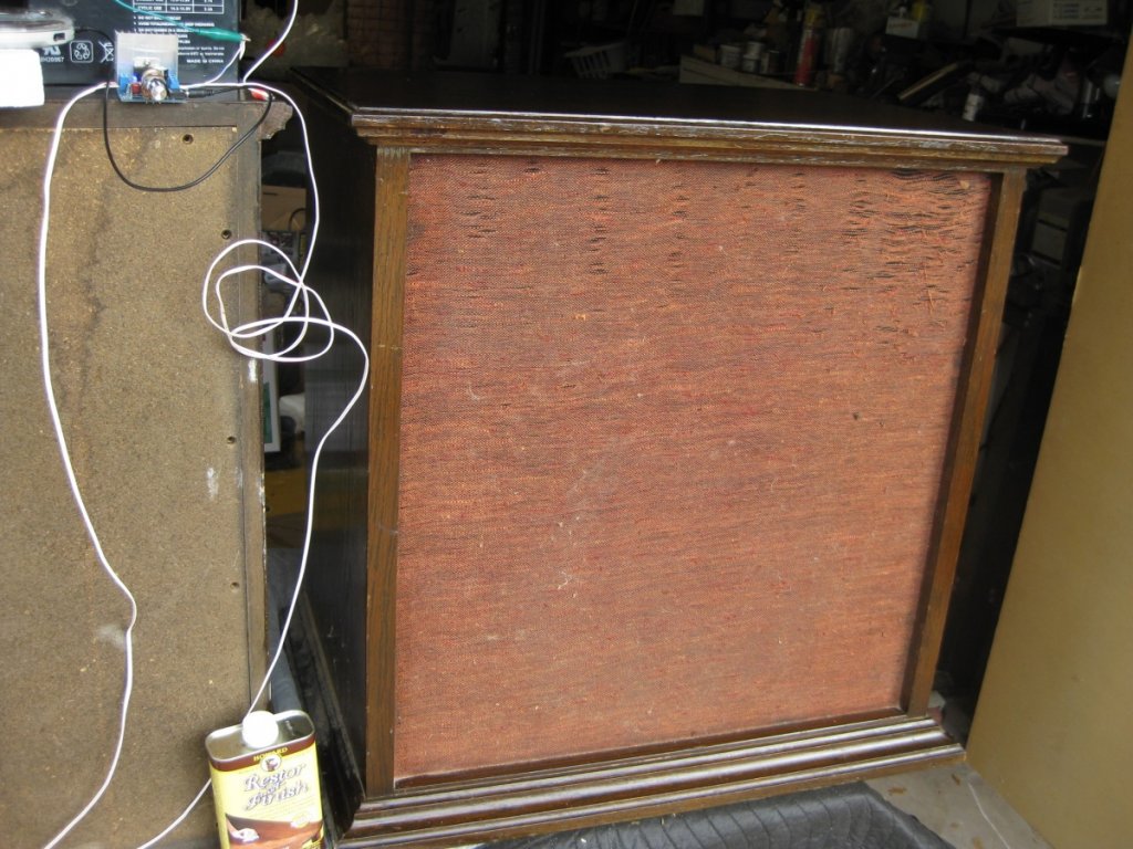 cabinet next to pint of walnut finish restorer