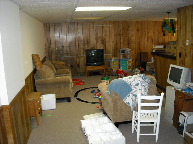 long view of front viewing wall from basement stairs