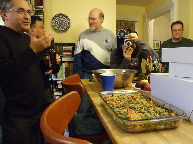 In the kitchen - Ravers gather around the center of the Omniverse, the food. Nancy special veggie dish as the center piece.