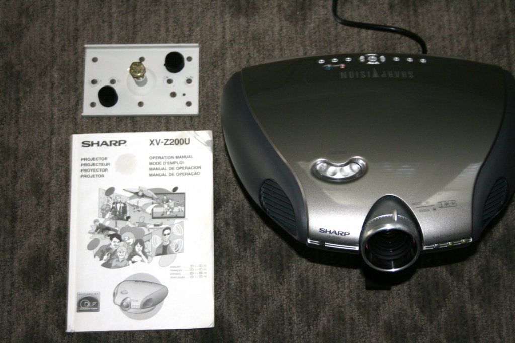 Sharp XV-Z200U Projector. Powers on, but bulb is dim and needs replaced. Only $50... retailed for $4,495 in 2004. See my add with pics on US Audio Mart.