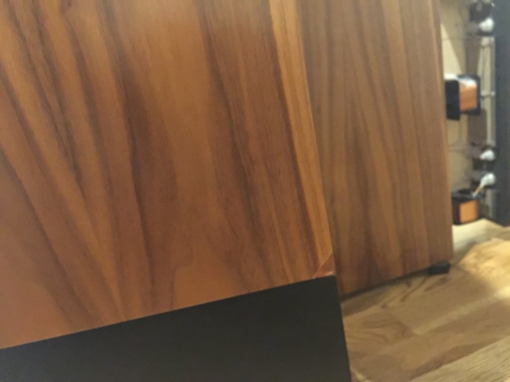 Chip on bottom of one speaker