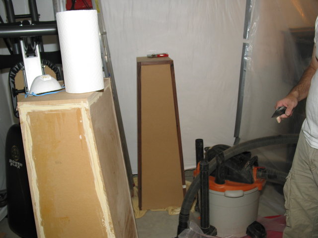 Sealing the cracks with wood filler, then sanding them down.