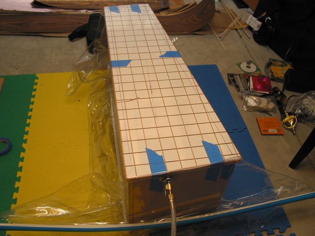 The veneer being pressed to the speaker. - I used the Project: V2 - Venturi Based Model (Using an air compressor) kit from joe woodwooker and a 4' x 6' 60 mil vinyl bag from www.joewoodworker.com.