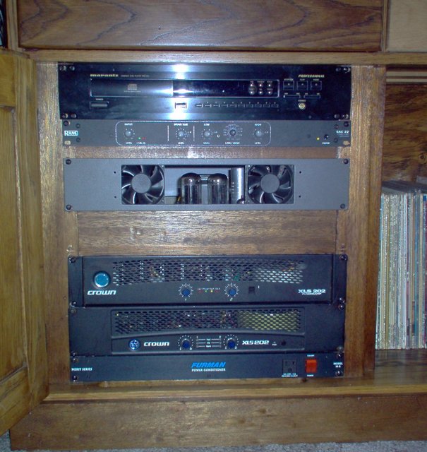 The Rack. - Marantz PMD 320 CD player used with the Tascam M-32 for live/Cd work, Rane active crossover, Columbia tube power amp for the Altec Lancing M-14 HF drivers, and two Crown XLS 202's bi-amped left/right for the AL M-14 LF drivers. Furman power conditioner. All housed in a redesigned and refinished old college bookcase bottom cabinet. It has an air slot in front and below the Crowns so I may have the doors shut when listening to music or watching a movie. The cooling fans for all the amps are "toned down quiet"