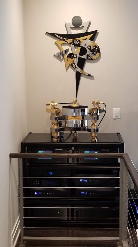 Rack of Equipment with Triangular Art over Triangle ART Master Reference Turntable