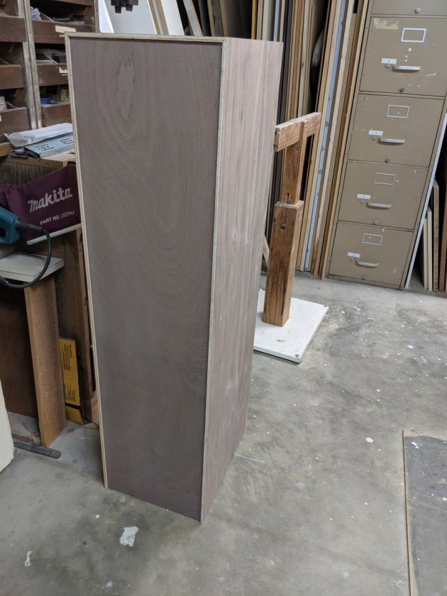 The back glued in place. The veneer on this is mahogany so stained to match, but after rethinking it, I'm going to paint the back black. The rear will get flush cut with a router later