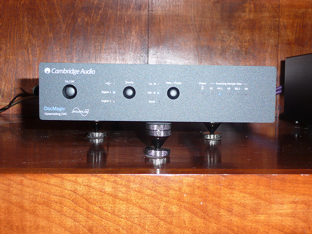 Cambridge Audio DACMagic. Added the three stick on cones from Parts Express. Can't say I notice a difference in sound, but I think they look cool : )